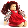 Doll in organic wool and cotton with blue eyes and  dark brown woolen hair. She is sitting and wears a striped sweat shirt and a red velvet gown.