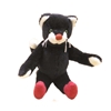 Cat made of black mohair is sitting, with red shoes, white hands, ears and snout and red nouse.