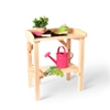 Solid pinewood kids potting table with stocking shelf beneath garnished with all kind of gardening tools for kids.
